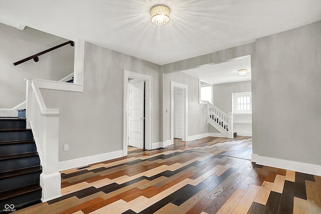 5053 E Michigan St, Indianapolis, IN 46201 - entrance foyer with stairway, hardwood / wood-style flooring, and baseboards