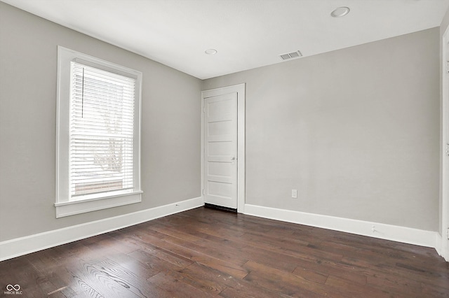 5053 E Michigan St, Indianapolis, IN 46201 - unfurnished room featuring plenty of natural light, dark wood-style flooring, baseboards, and recessed lighting