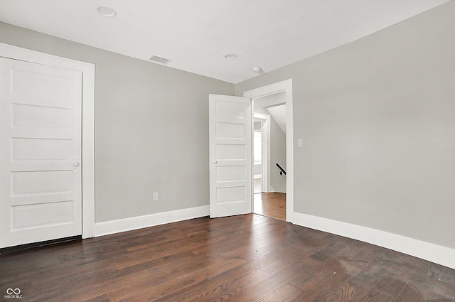 5053 E Michigan St, Indianapolis, IN 46201 - spare room with baseboards, dark wood-style floors, and recessed lighting