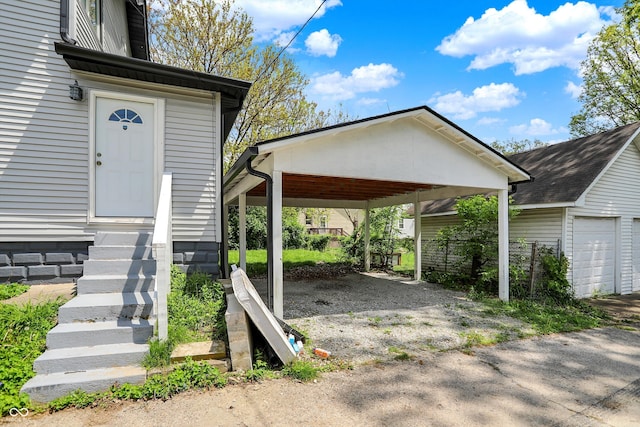 5053 E Michigan St, Indianapolis, IN 46201 - exterior space with entry steps and a detached carport