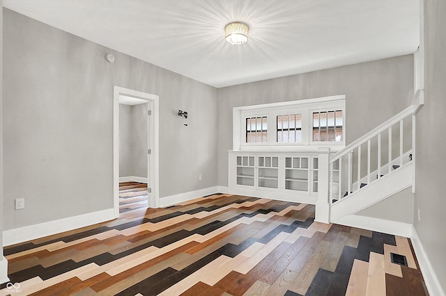 5053 E Michigan St, Indianapolis, IN 46201 - entryway with hardwood / wood-style flooring, stairway, and baseboards