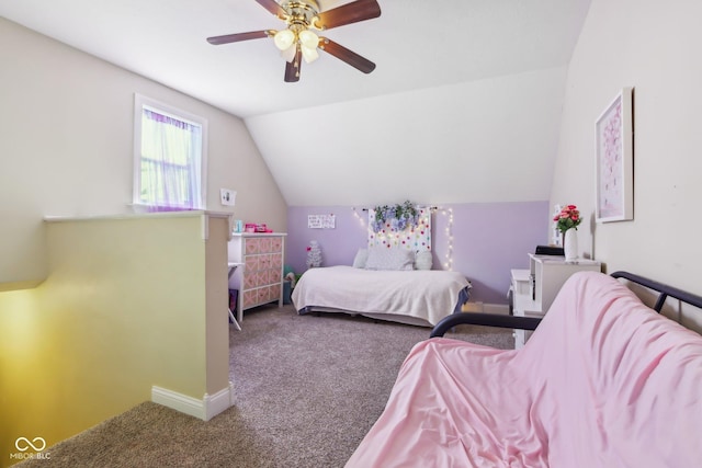 bedroom featuring carpet, vaulted ceiling, baseboards, and ceiling fan