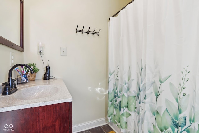 bathroom featuring vanity and baseboards