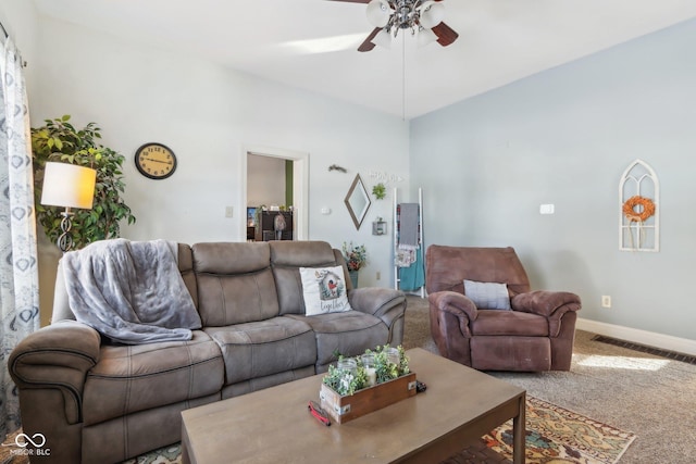 living room with carpet floors, visible vents, baseboards, and a ceiling fan