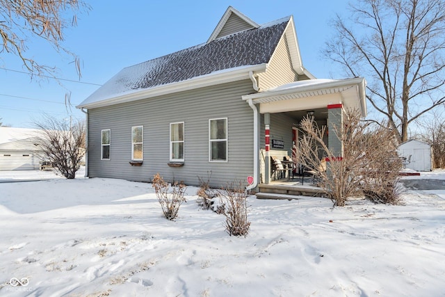 exterior space with a shed and a porch