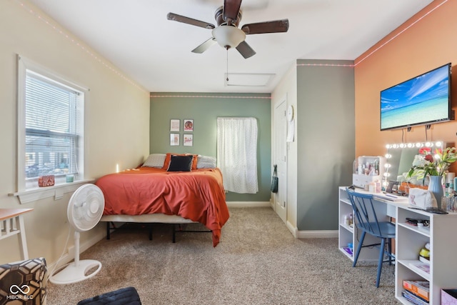 bedroom featuring a ceiling fan, light carpet, and baseboards