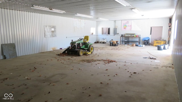 garage featuring metal wall and electric panel