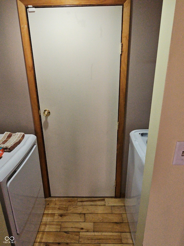 laundry area featuring laundry area and wood tiled floor