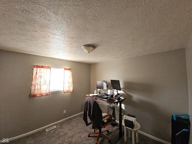 office with carpet floors, visible vents, and baseboards