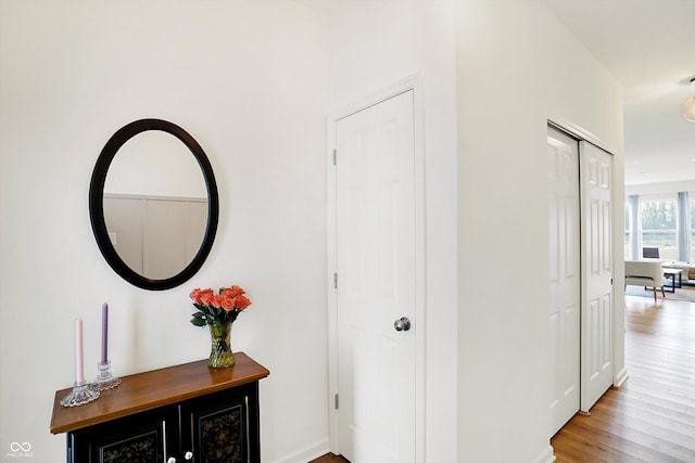 corridor with wood finished floors