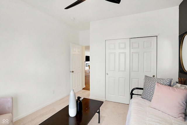 living room with light carpet, ceiling fan, and baseboards