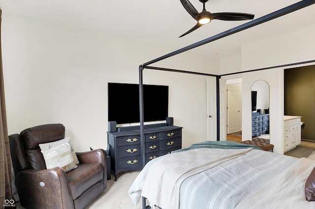 bedroom with a ceiling fan and light colored carpet