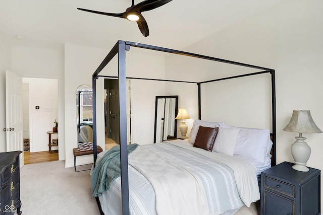 bedroom with light carpet and ceiling fan