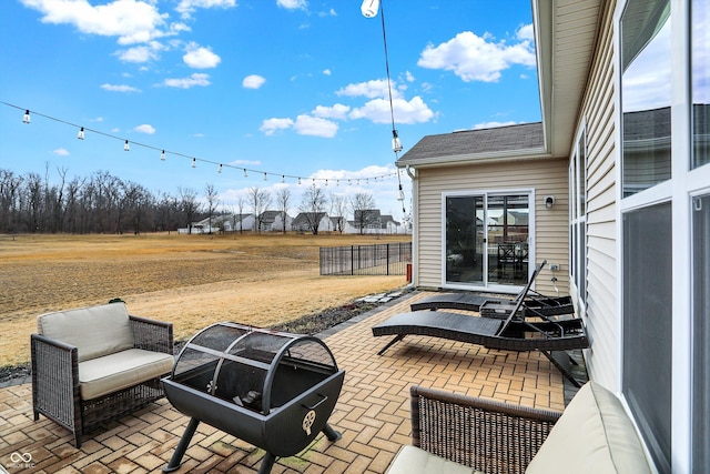 view of patio featuring fence