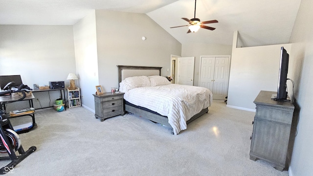 bedroom featuring ceiling fan, high vaulted ceiling, a closet, and baseboards