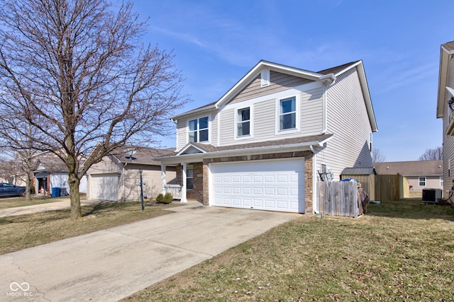 traditional-style home with central air condition unit, fence, concrete driveway, a garage, and brick siding