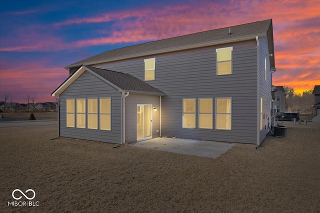 back of house with a patio area and central AC unit