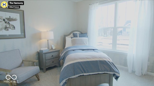 bedroom featuring baseboards, multiple windows, and carpet flooring