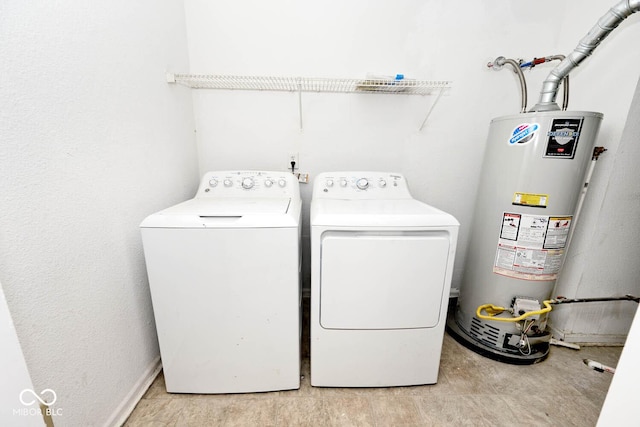 laundry room featuring water heater, laundry area, and independent washer and dryer