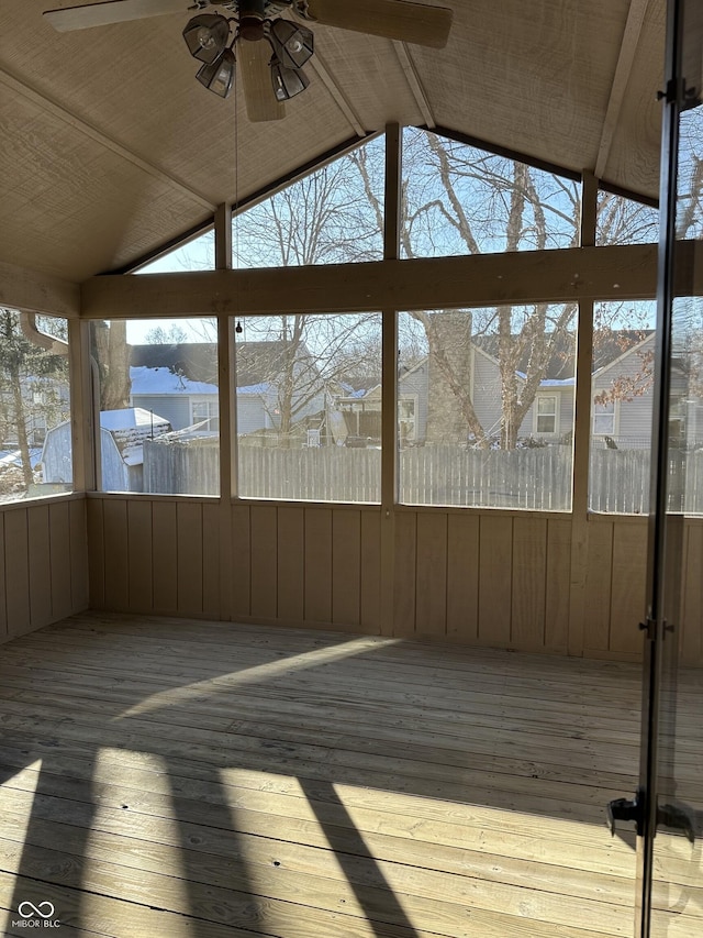 unfurnished sunroom featuring vaulted ceiling and ceiling fan