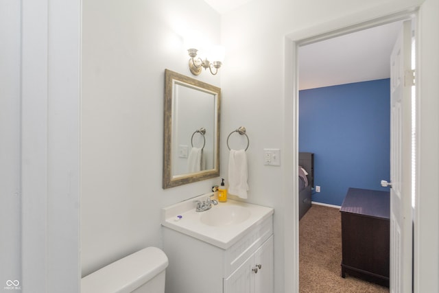 bathroom with toilet and vanity