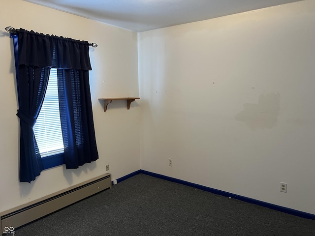 unfurnished room with a baseboard radiator, baseboards, and dark colored carpet