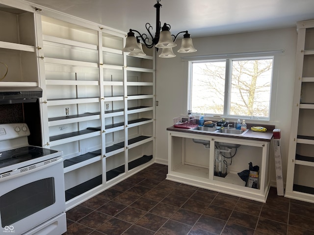 interior space featuring white range with electric stovetop, hanging light fixtures, a sink, ventilation hood, and a notable chandelier