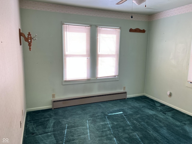 carpeted empty room featuring baseboard heating, a wealth of natural light, and baseboards