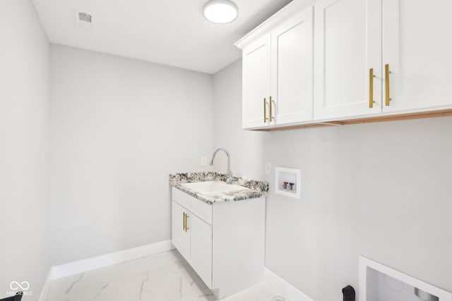 laundry room featuring washer hookup, a sink, baseboards, marble finish floor, and cabinet space