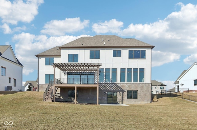 back of property featuring brick siding, a lawn, stairway, fence, and a pergola