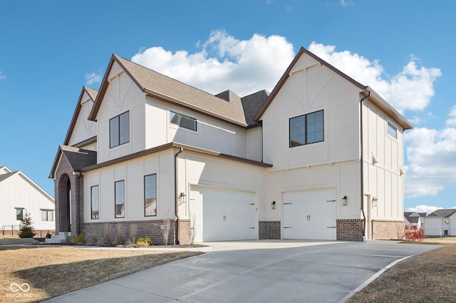 view of front of house featuring a garage, driveway, brick siding, and board and batten siding