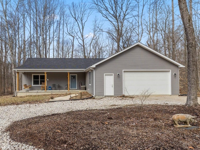 ranch-style house with a porch, a shingled roof, and an attached garage