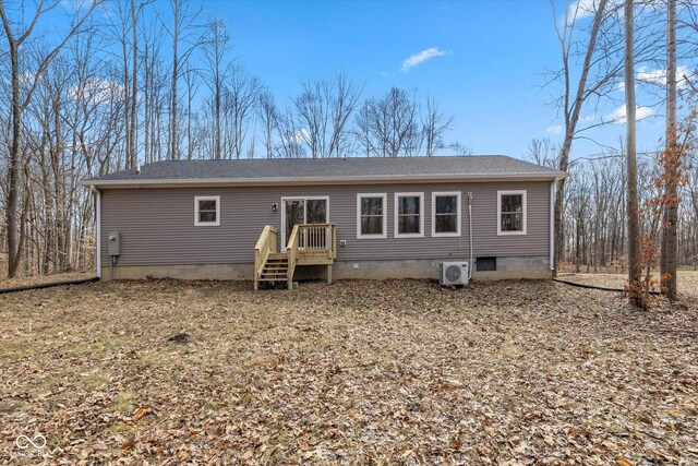 back of house with ac unit