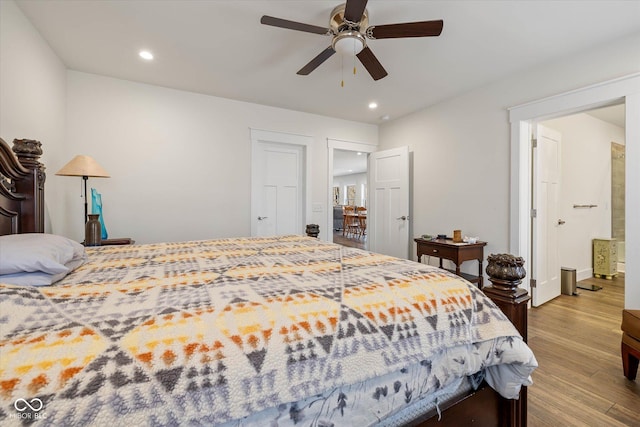 bedroom with recessed lighting, ceiling fan, and wood finished floors