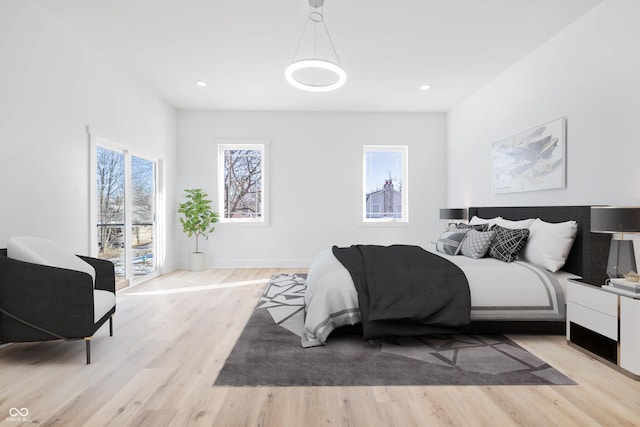 bedroom featuring light wood-type flooring, baseboards, and recessed lighting