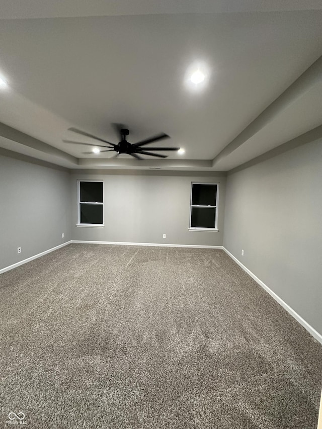 empty room featuring ceiling fan, recessed lighting, carpet flooring, and baseboards