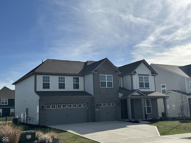 4187 Risen Star Way, Bargersville, IN 46106 - view of front of house with concrete driveway, central air condition unit, fence, board and batten siding, and a garage