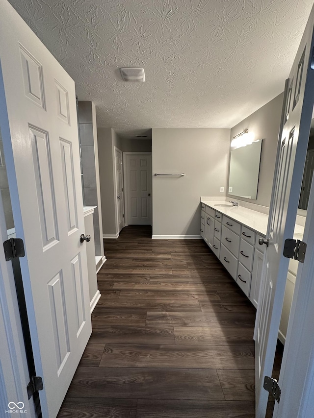 4187 Risen Star Way, Bargersville, IN 46106 - bathroom with vanity, a textured ceiling, baseboards, and wood finished floors