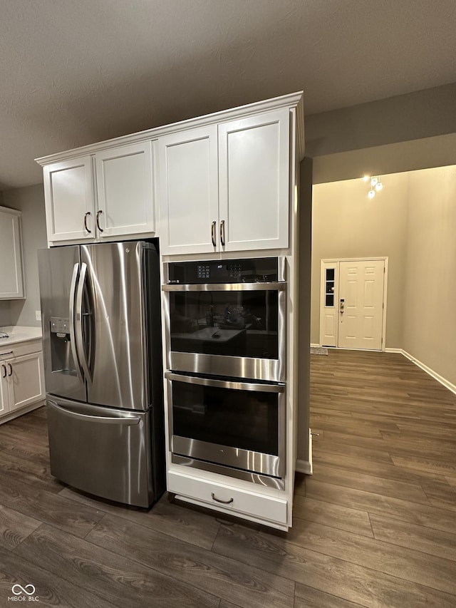4187 Risen Star Way, Bargersville, IN 46106 - kitchen with dark wood-style floors, white cabinets, and stainless steel appliances