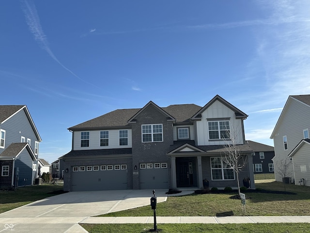 4187 Risen Star Way, Bargersville, IN 46106 - view of front of house with central air condition unit, an attached garage, board and batten siding, driveway, and a front lawn