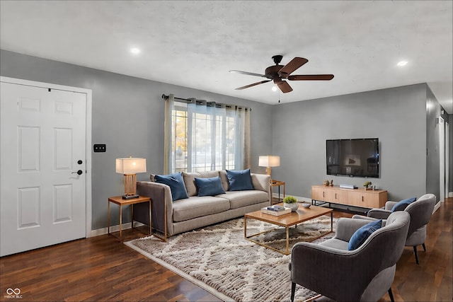 living room with ceiling fan, dark wood-type flooring, recessed lighting, and baseboards