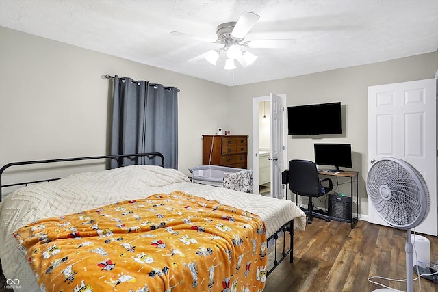 bedroom featuring dark wood-style floors, ceiling fan, and a textured ceiling