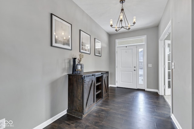 entrance foyer featuring dark wood-style floors and baseboards