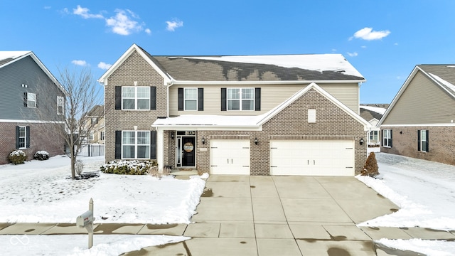 traditional home with concrete driveway and brick siding