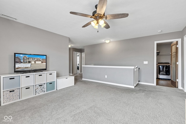 unfurnished living room featuring carpet floors, visible vents, ceiling fan, and baseboards