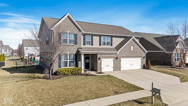 traditional-style house with brick siding, an attached garage, a front lawn, cooling unit, and driveway