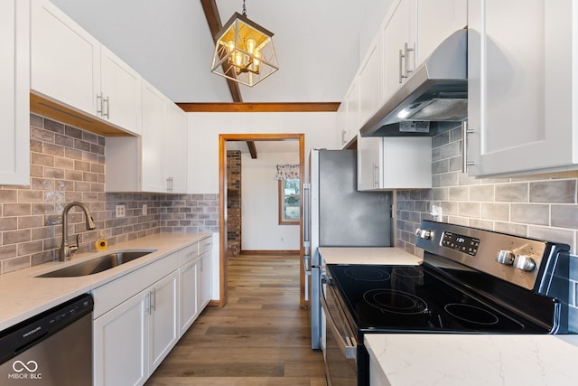 kitchen with appliances with stainless steel finishes, pendant lighting, white cabinets, and under cabinet range hood