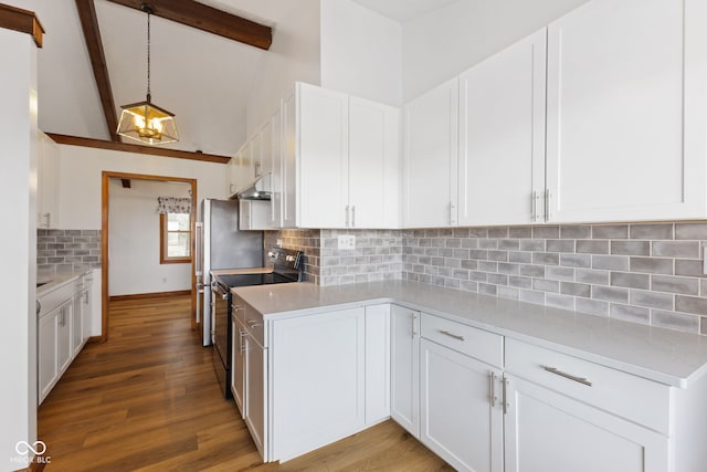 kitchen featuring pendant lighting, vaulted ceiling with beams, electric range, light wood-style floors, and white cabinetry