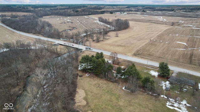 birds eye view of property featuring a rural view