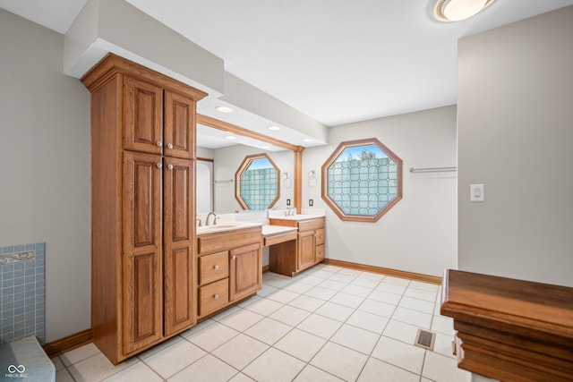 bathroom featuring baseboards, recessed lighting, vanity, and tile patterned floors